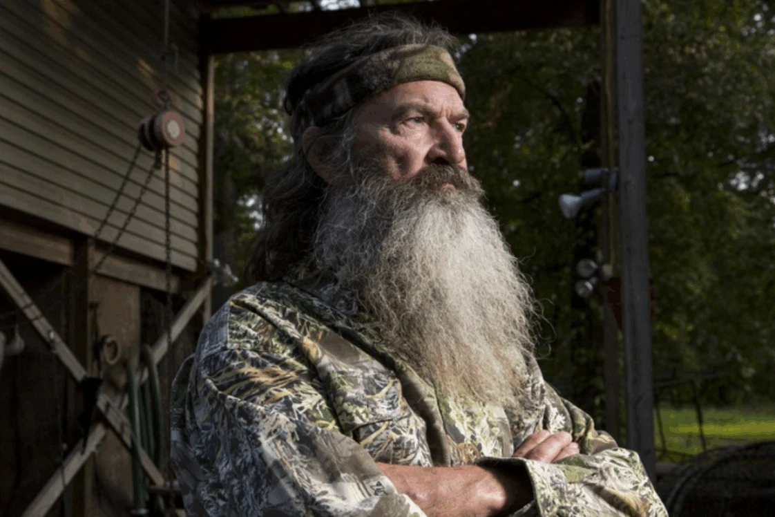 Phil Robertson surrounded by his family, showcasing the unity and love that defined the Duck Dynasty clan.